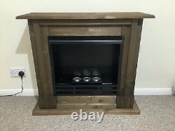 Biofuel canisters in solid wooden fireplace with Extinguisher & Fuel Saving Rings